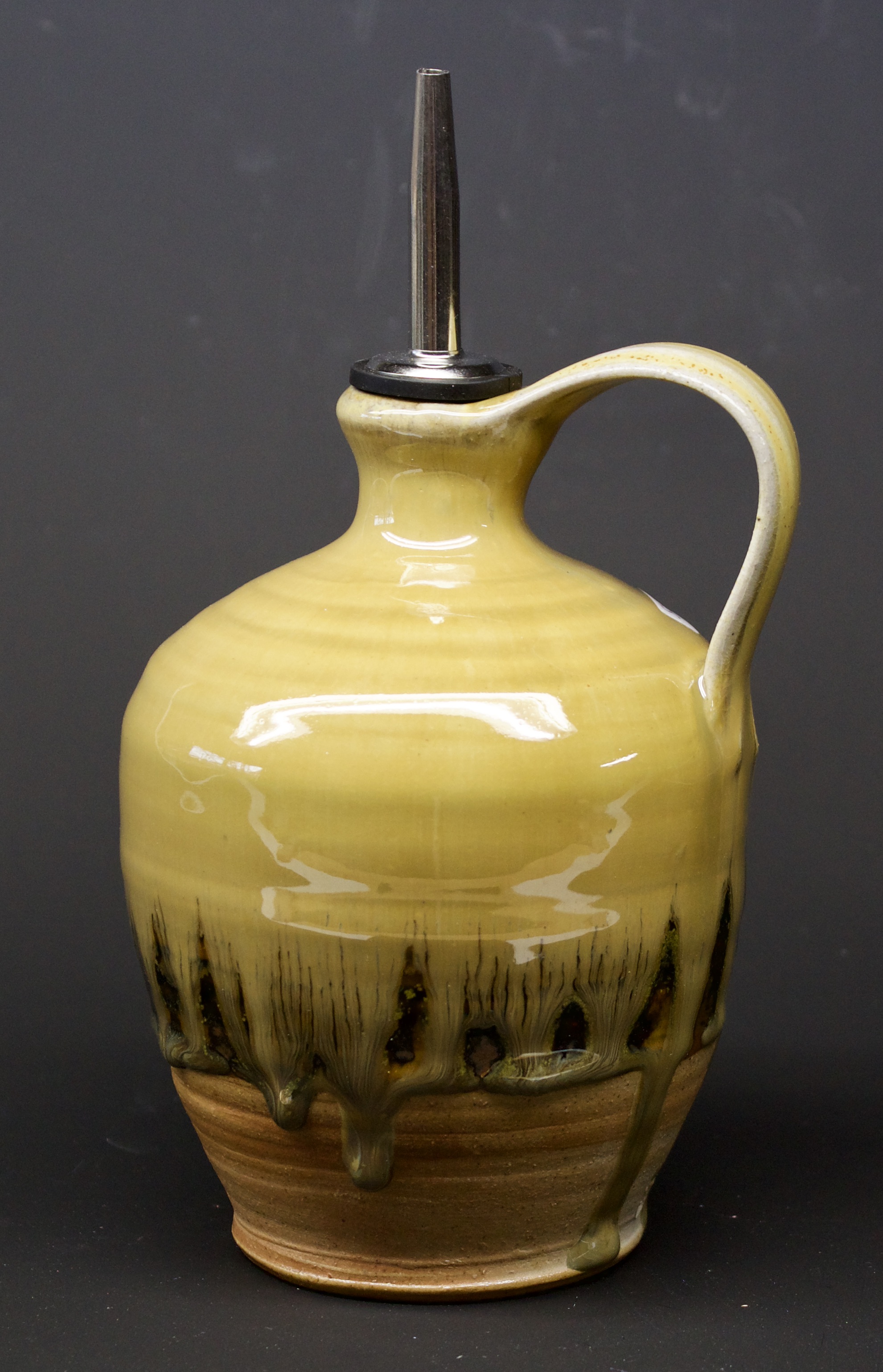 18. Olive oil bottle, Tenmoku & thistle glaze,  6" x 4"
$75