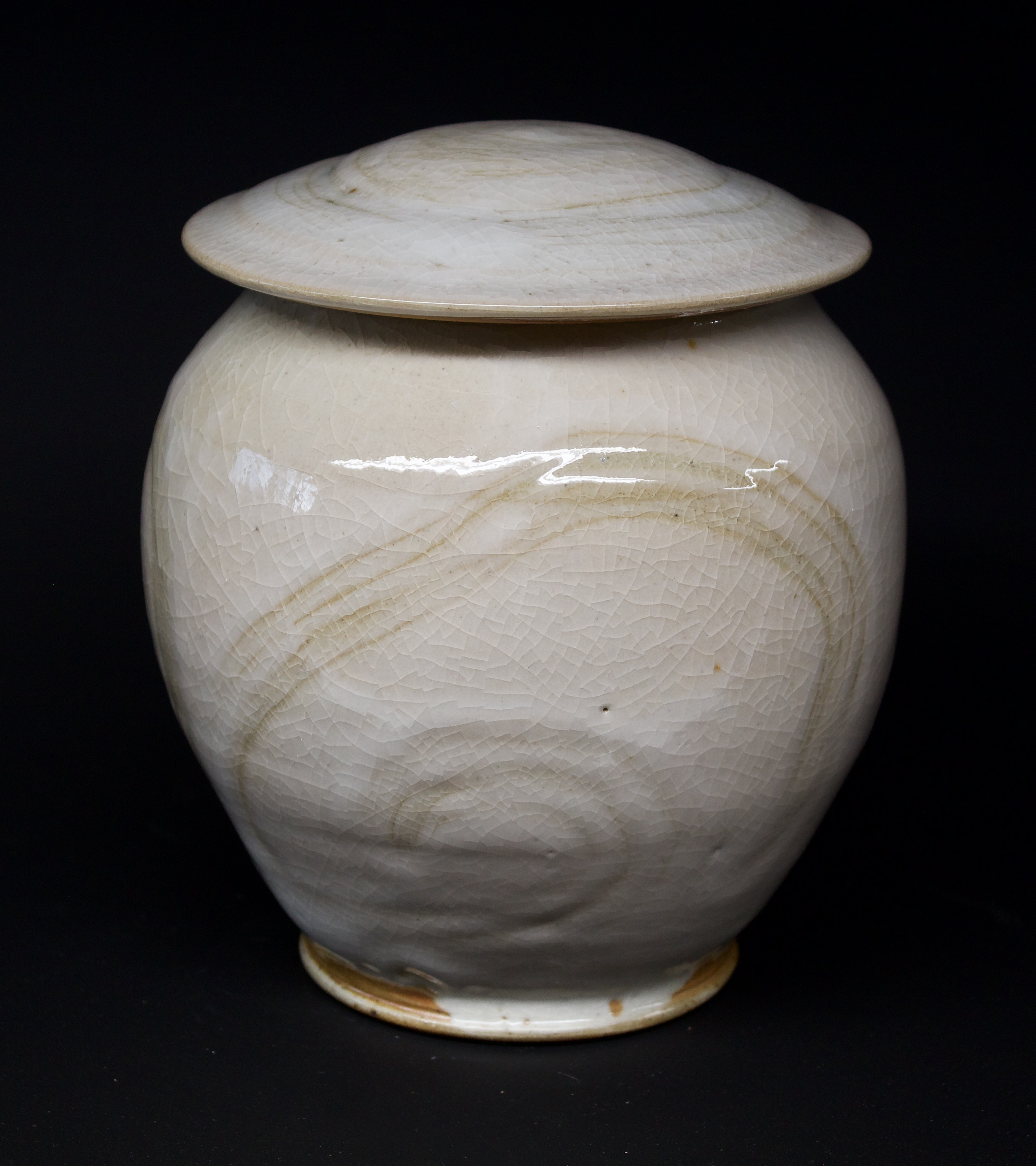 24. Jar with lid, Shino glaze
7.5" x 6"
$375