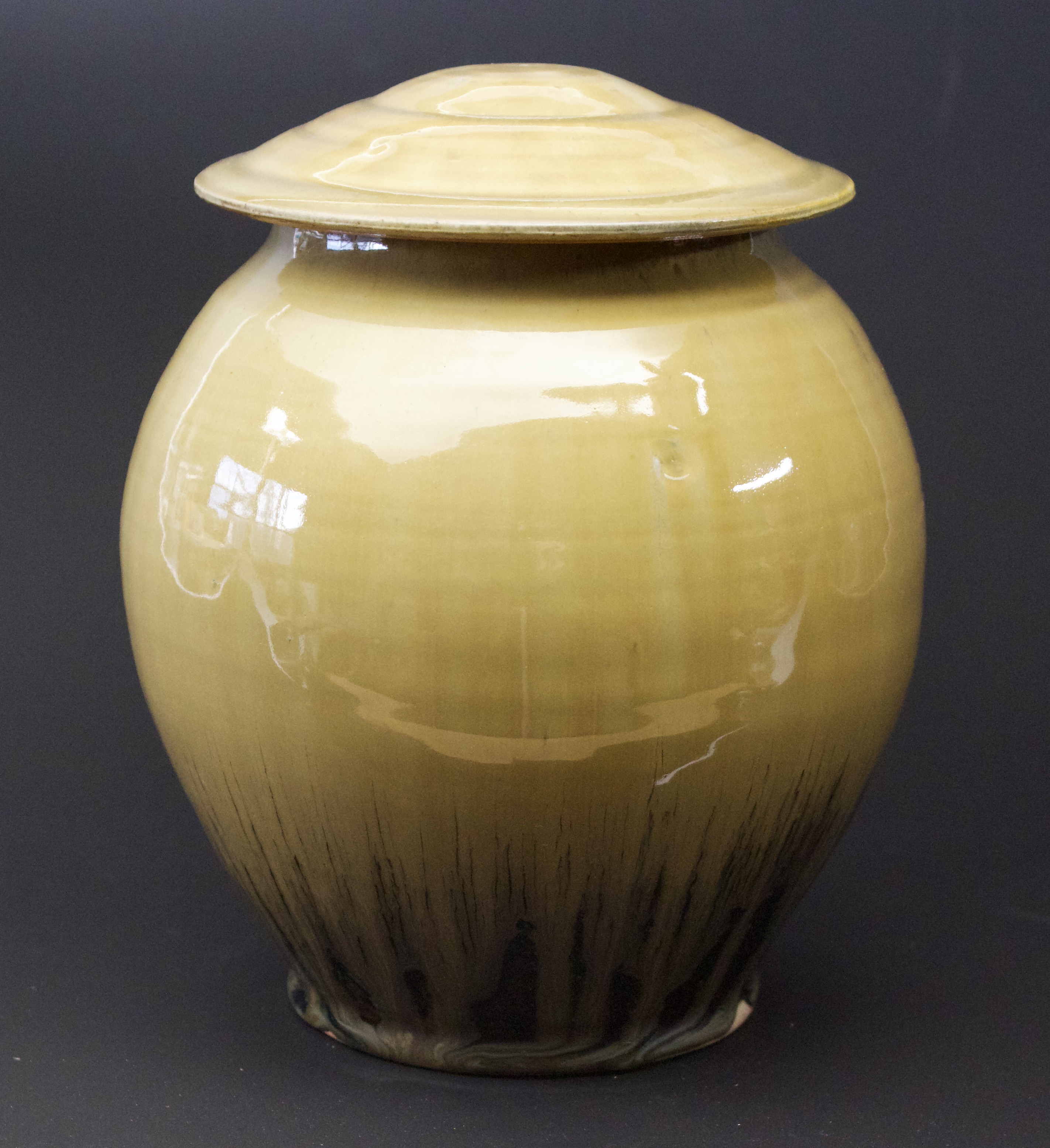 25. Jar with lid, Tenmoku & ash glaze
8" x 6"
$375